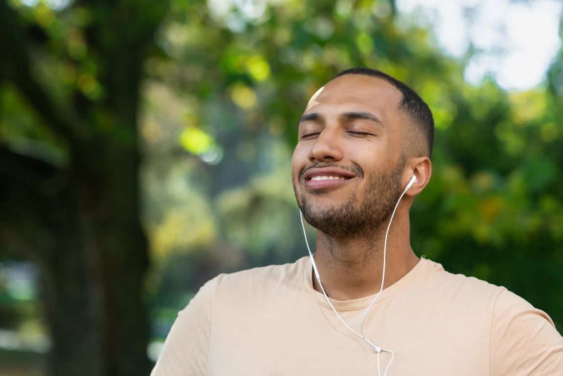 man enjoying a walk and listening to music